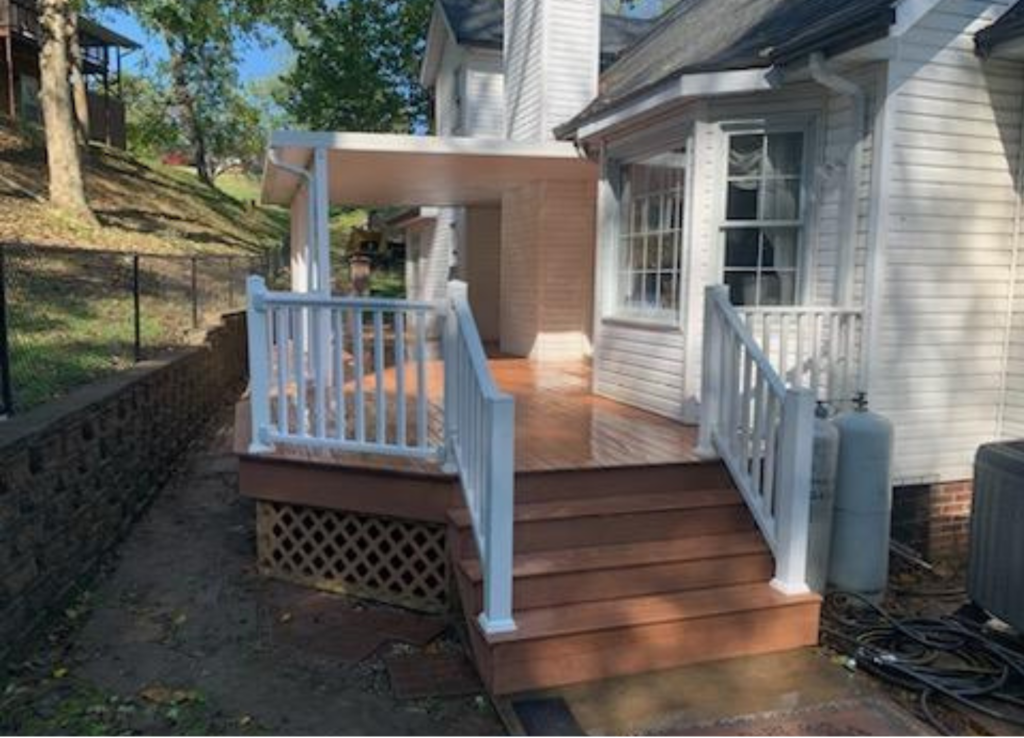 Brown composite deck with white banister
